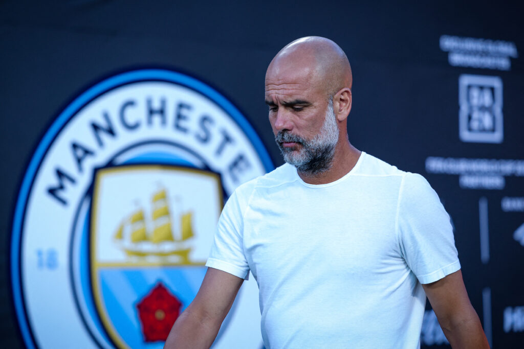 Pep Guardiola looking on during a Man City match