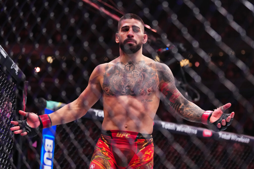 Ilia Topuria celebrates his knockout win over Charles Oliveira at UFC 317