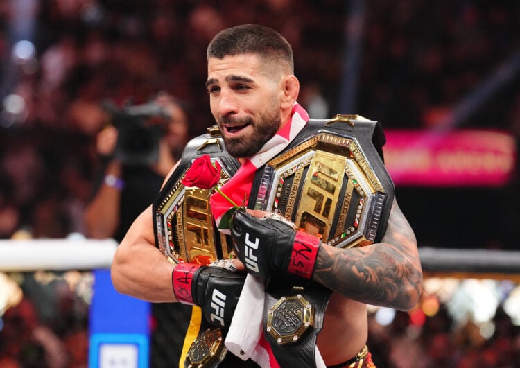 Ilia Topuria celebrates his lightweight title win against Charles Oliveira at UFC 317