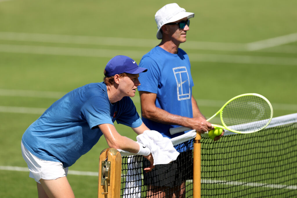Jannik Sinner takes a break during a practice session prior to The Championships Wimbledon 2025