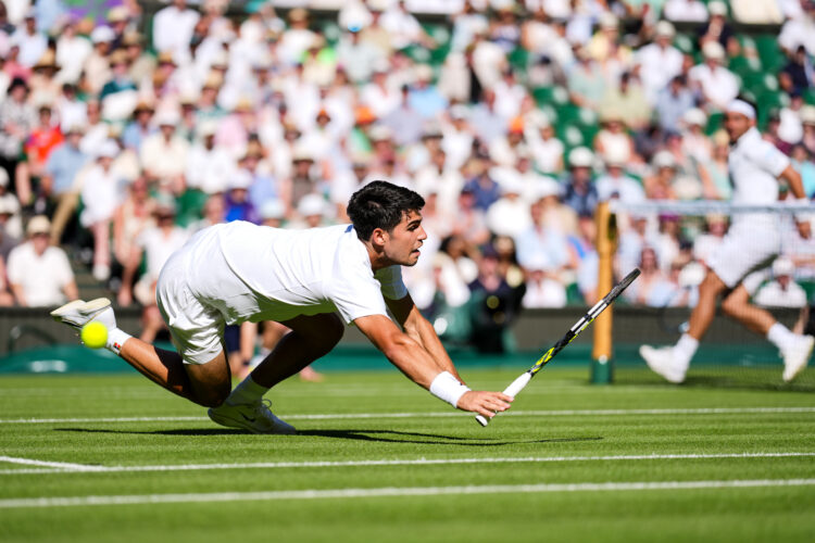 Carlos Alcaraz falls against in match against Fabio Fognini in round one of Wimbledon 2025