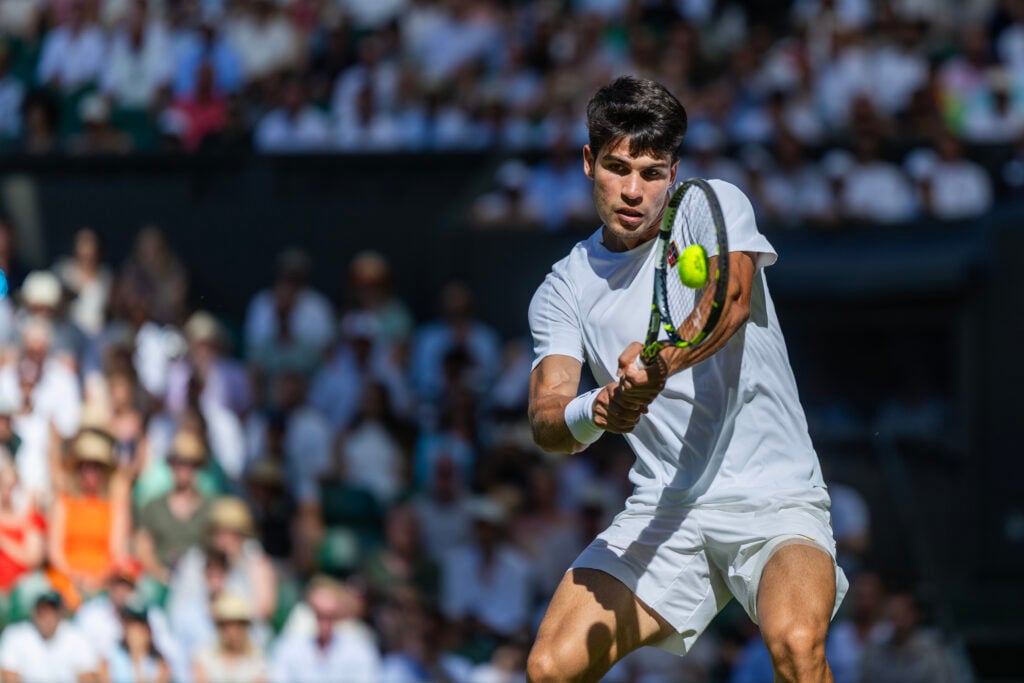 Carlos Alcaraz playing Fabio Fognini at Wimbledon 2025