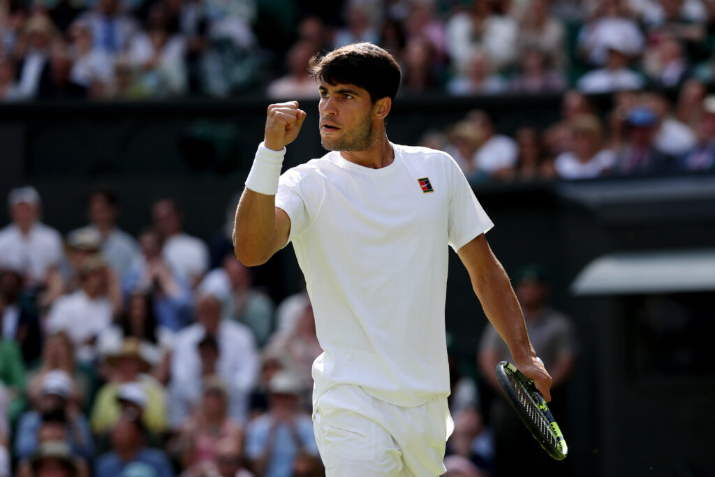 Carlos Alcaraz celebrating a point at Wimbledon 2025