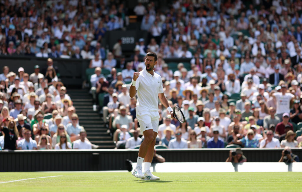Novak Djokovic of Serbia plays a celebrates against Daniel Evans of Great Britain