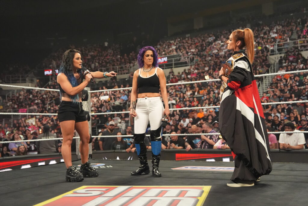Becky Lynch, Lyra Valkyria, and Bayley squaring off on WWE Monday Night RAW