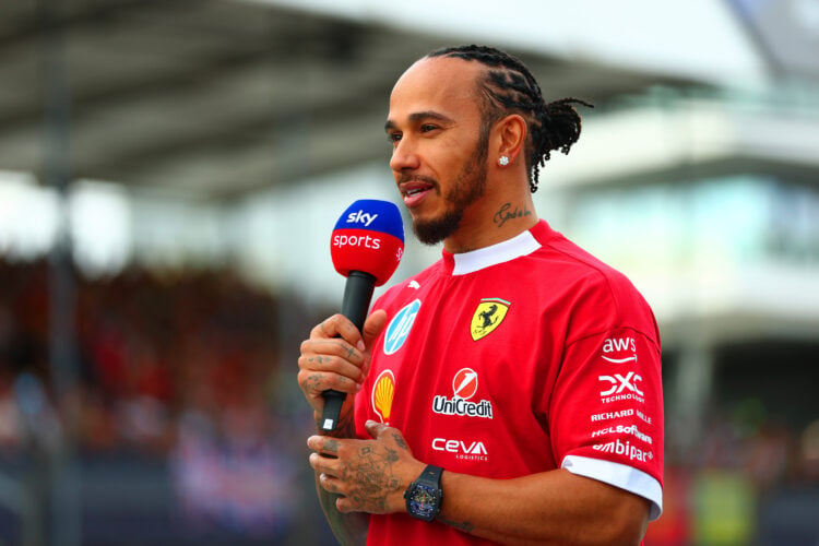 Lewis Hamilton of Ferrari is interviewed ahead of the F1 Grand Prix of Great Britain