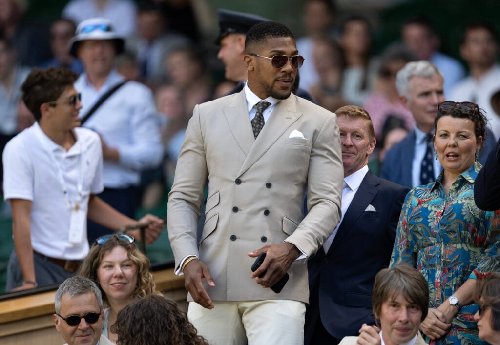 Professional boxer Anthony Joshua finds his seat in the royal box