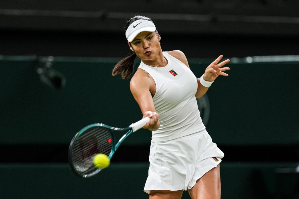 Emma Raducanu striking the ball at Wimbledon 2025