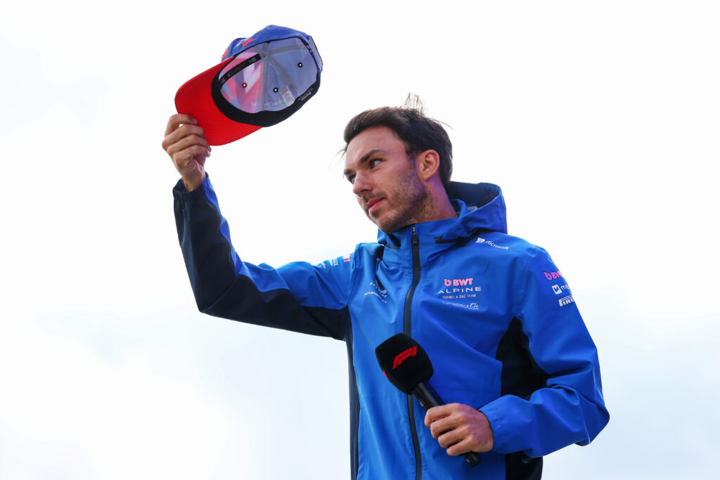 Pierre Gasly waves while in action for Alpine