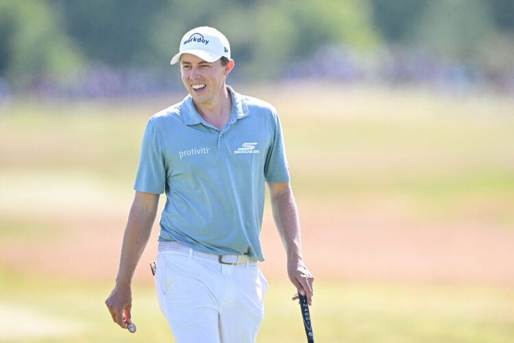 Matt Fitzpatrick of England laughs while playing at the Genesis Scottish Open 2025