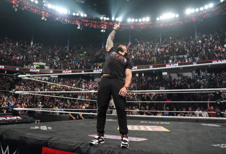 Roman Reigns pointing to the sky during his WWE return on Monday Night Raw