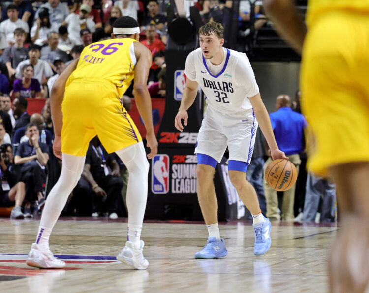 Cooper Flagg #32 of the Dallas Mavericks brings the ball up the court against Darius Bazley #36 of the Los Angeles Lakers