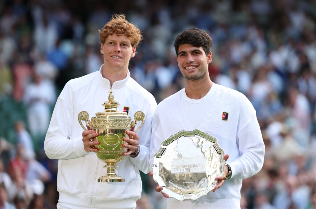 Carlos Alcaraz and Jannik Sinner with their respective Wimbledon trophies in 2025