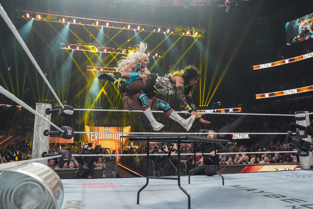 Naomi is put through a table by Jade Cargill at Evolution 2