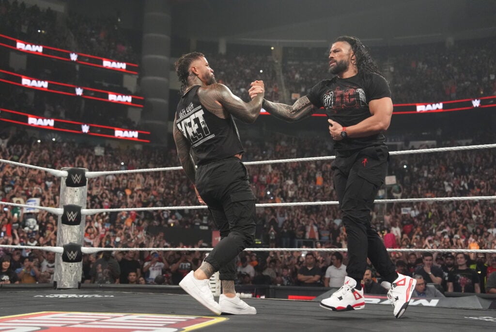 Roman Reigns and Jey Uso shaking hands on WWE's Monday Night RAW
