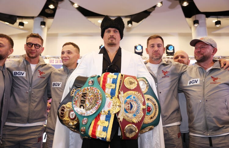 Oleksandr Usyk poses for a photo with his belts