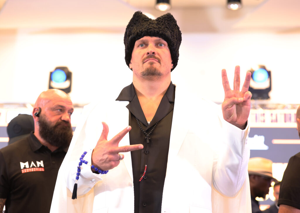 Oleksandr Usyk poses for a photo