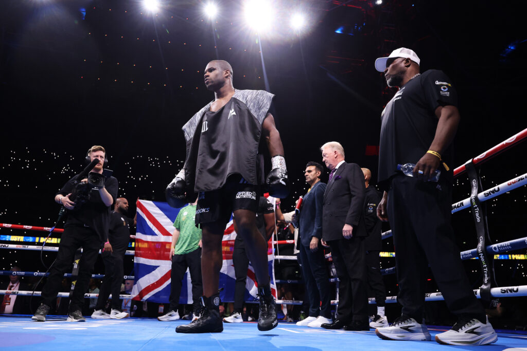 Daniel Dubois stands in the ring ahead of Oleksandr Usyk clash