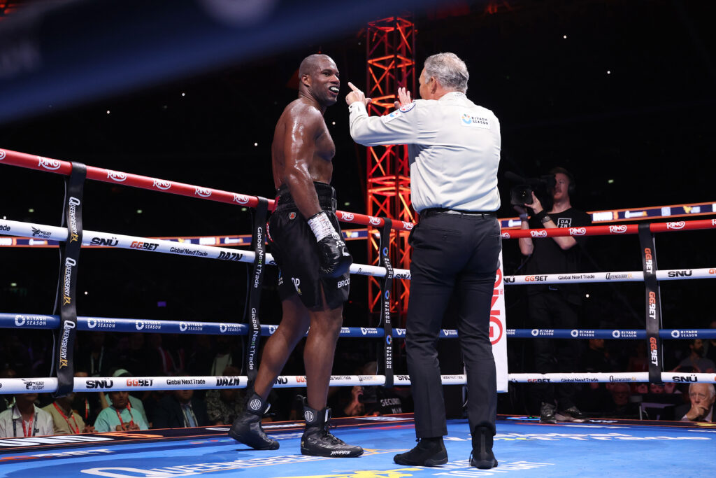 Referee Michael Griffin interacts with Daniel Dubois after being knocked down by Oleksandr Usyk