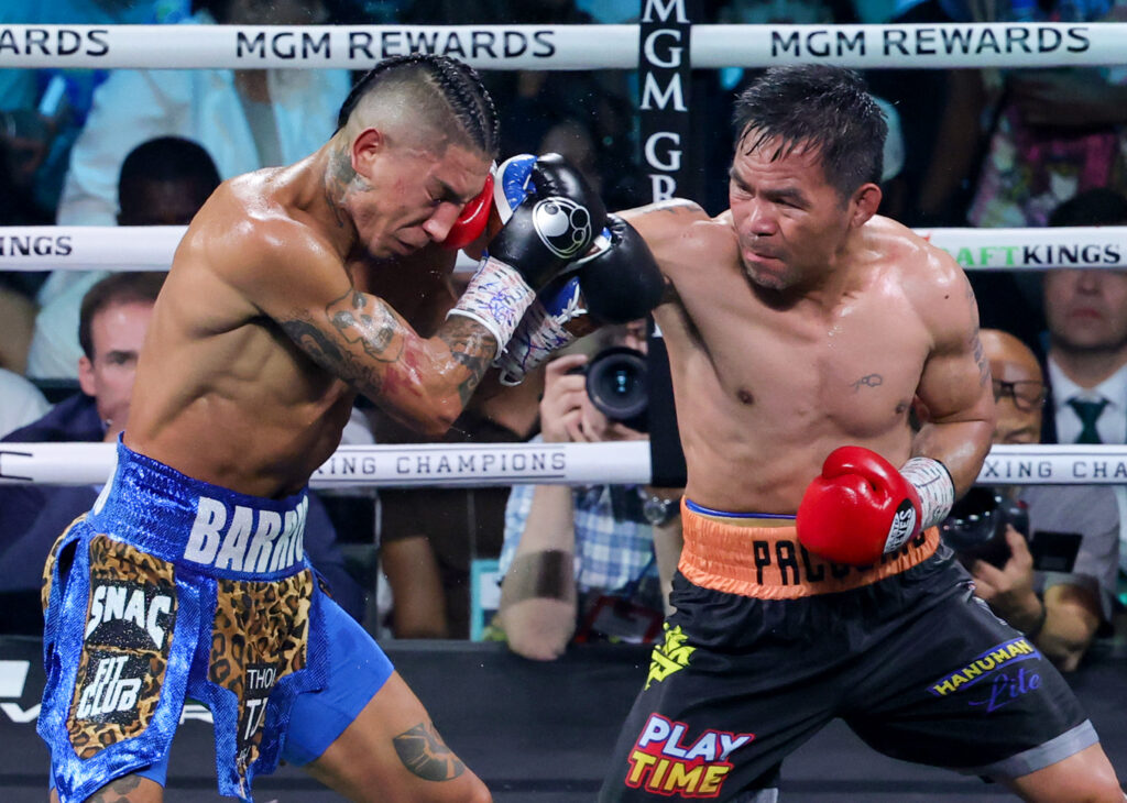 Manny Pacquiao throws a right at Mario Barrios