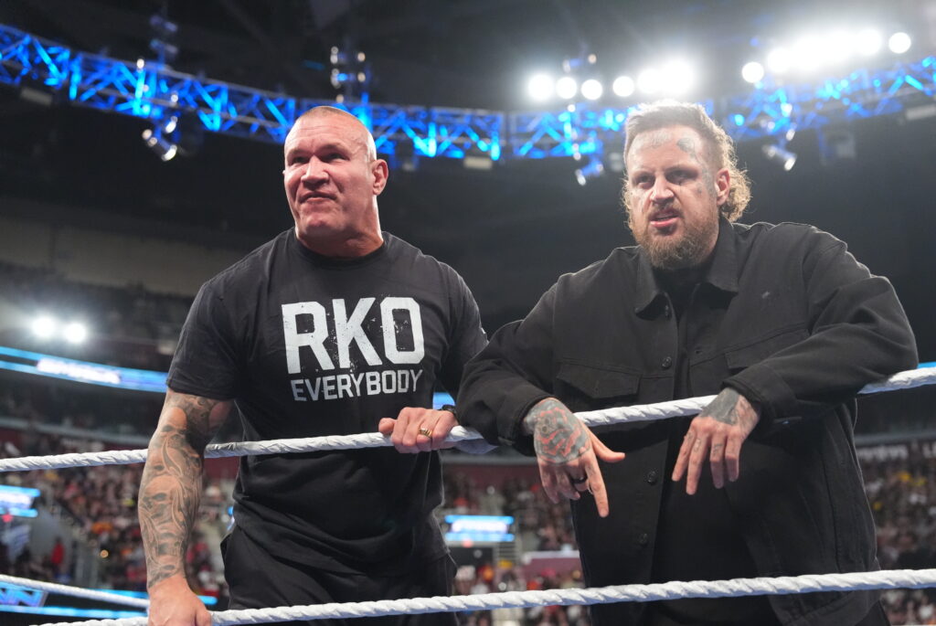 Randy Orton and Jelly Roll looking down on Drew McIntyre and Logan Paul on WWE SmackDown
