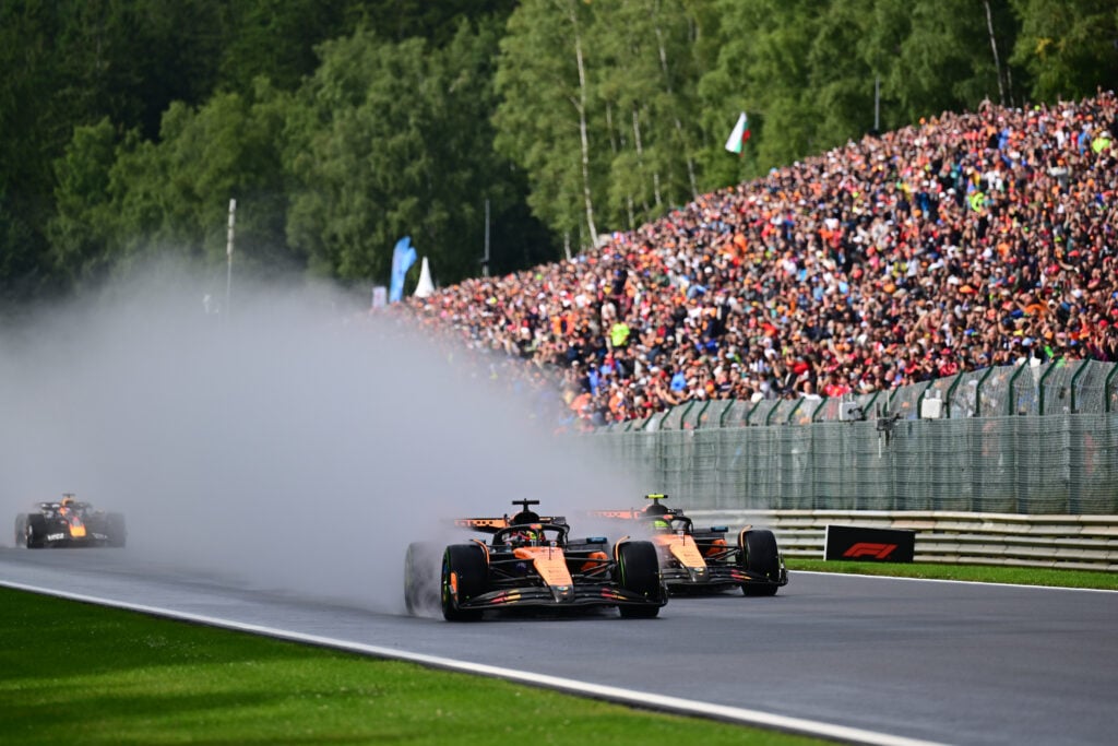 Oscar Piastri of the McLaren F1 Team overtakes Lando Norris