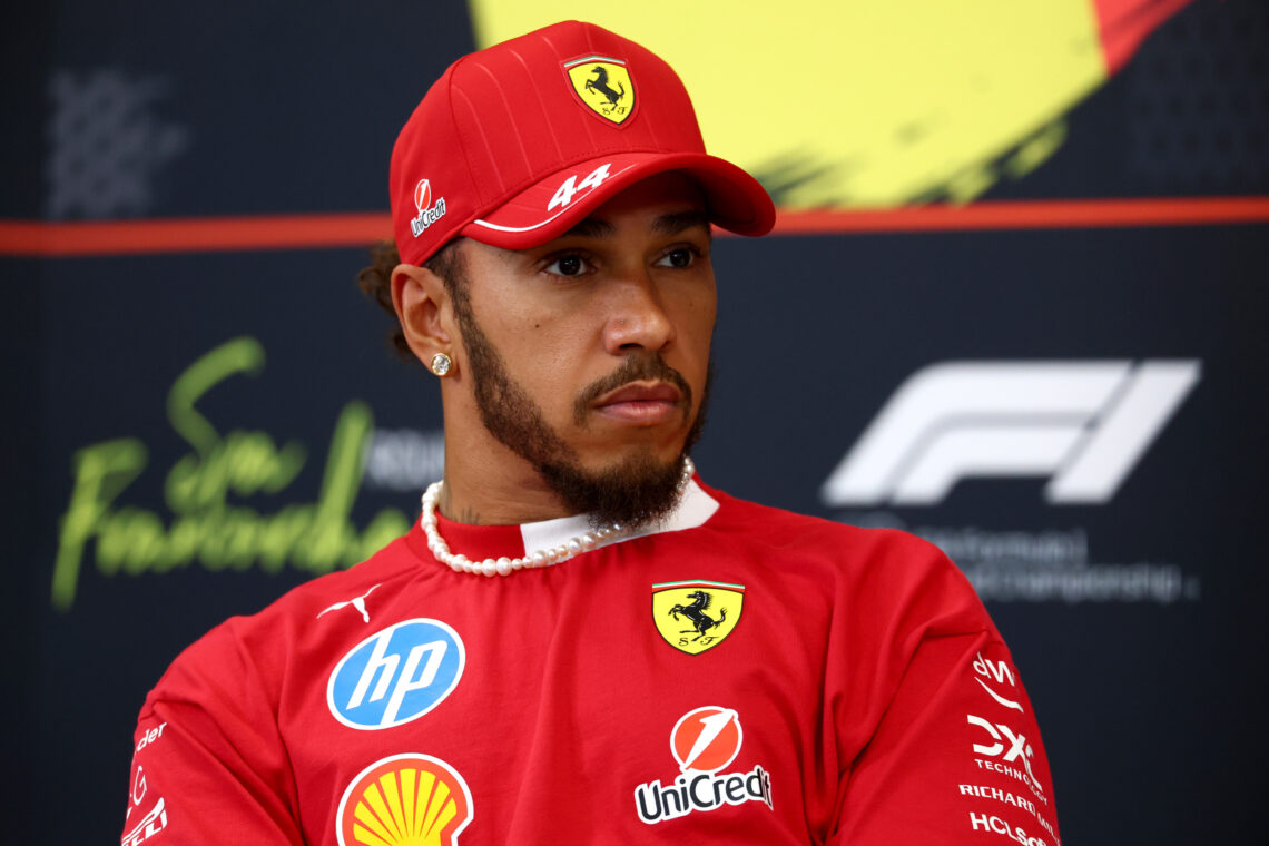 Lewis Hamilton of Great Britain and Scuderia Ferrari looks on in the Drivers Press Conference