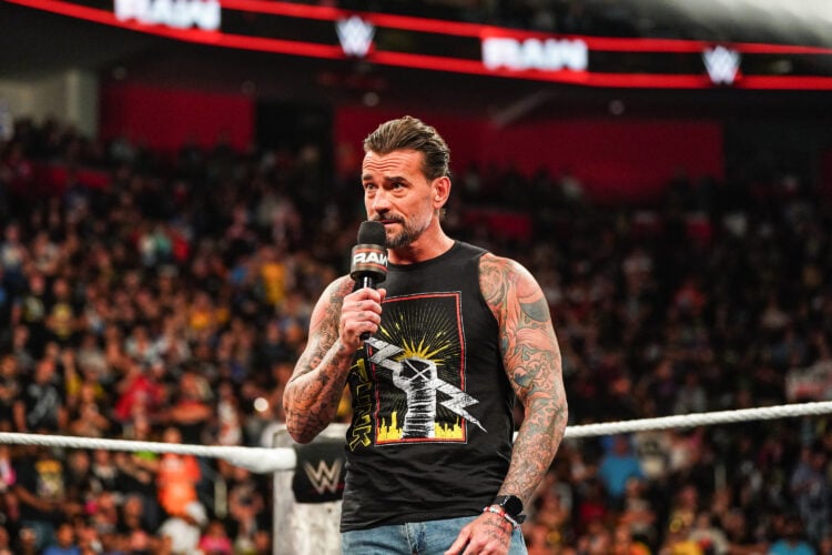 CM Punk cutting a promo on WWE Raw with an inset of AJ Lee