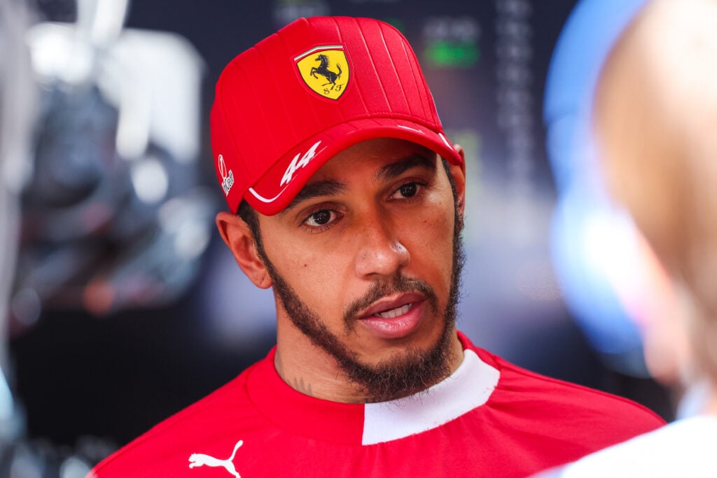 Lewis Hamilton of Ferrari answers questions in the TV media pen
