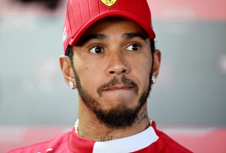 Lewis Hamilton of Great Britain and Scuderia Ferrari talks to the media
