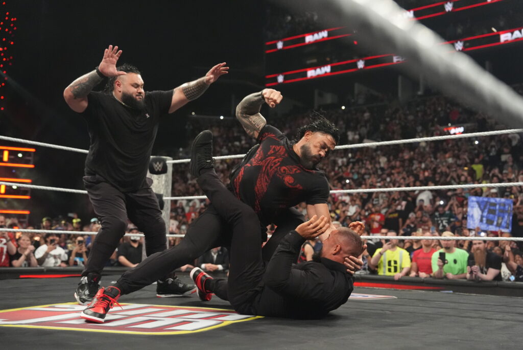 Roman Reigns attacking Bron Breakker on WWE Monday Night RAW