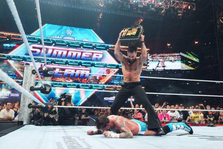 Seth Rollins attacking CM Punk with the Money in the Bank briefcase at WWE SummerSlam