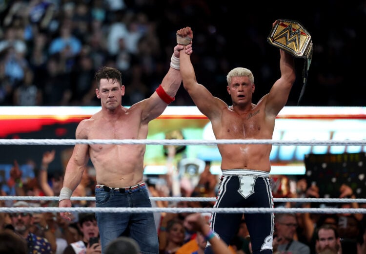 John Cena lifting up Cody Rhodes' hands after their WWE SummerSlam match