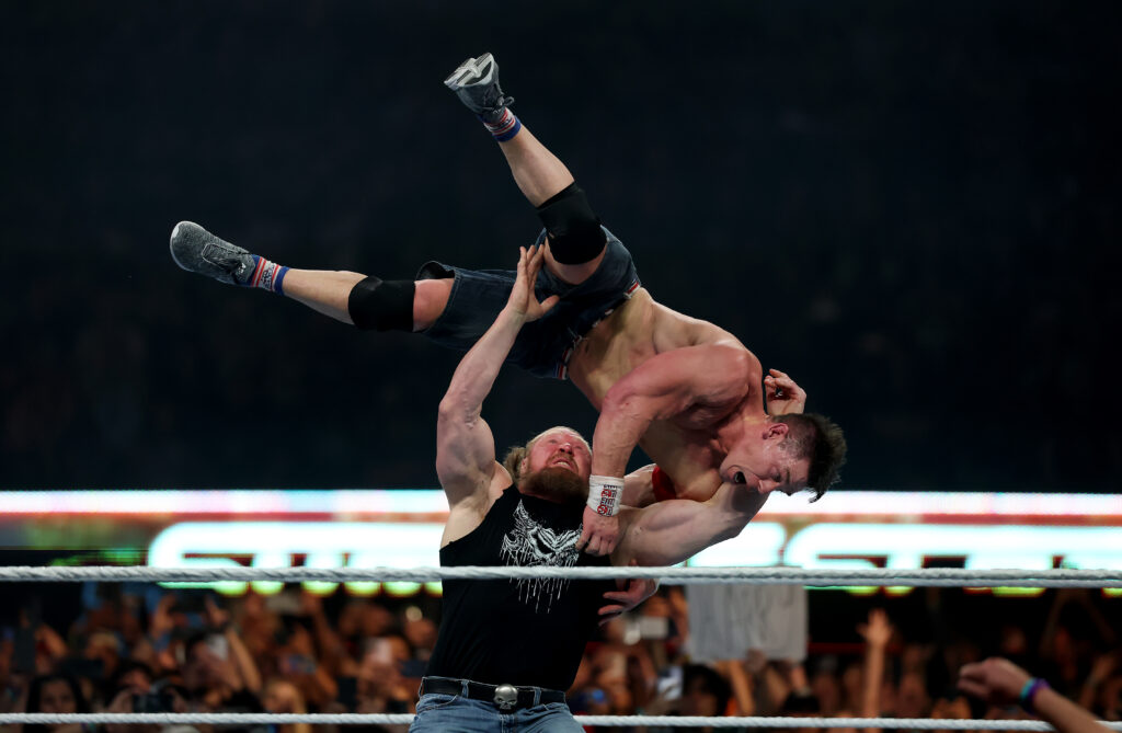 Brock Lesnar hitting John Cena with an F5 at WWE SummerSlam
