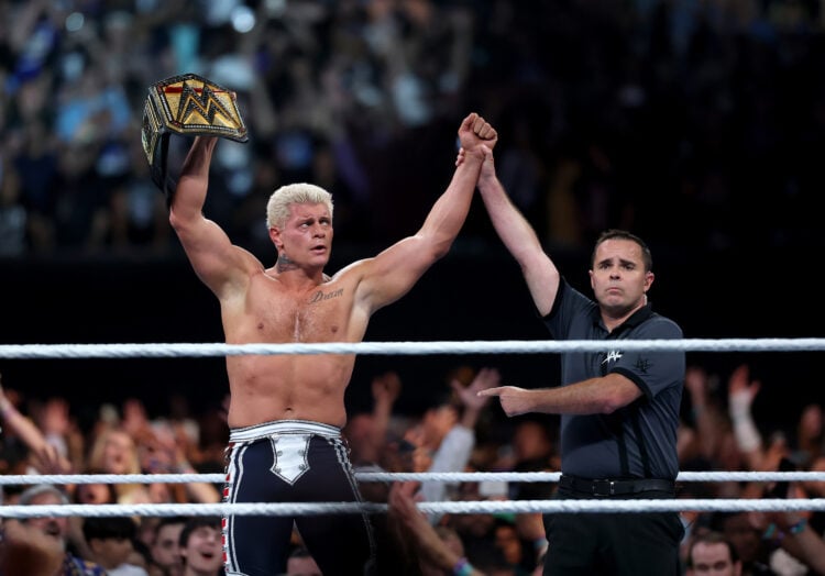 Cody Rhodes lifting the WWE Championship aloft after winning the belt at SummerSlam 2025