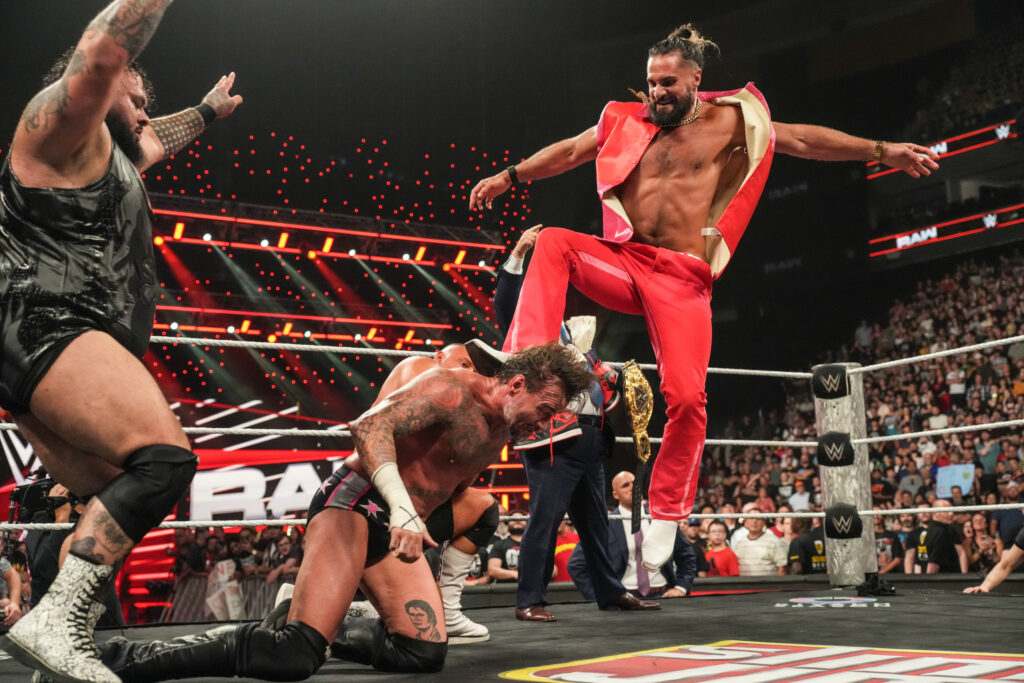 Seth Rollins hitting CM Punk with a Curb Stomp on WWE Monday Night RAW