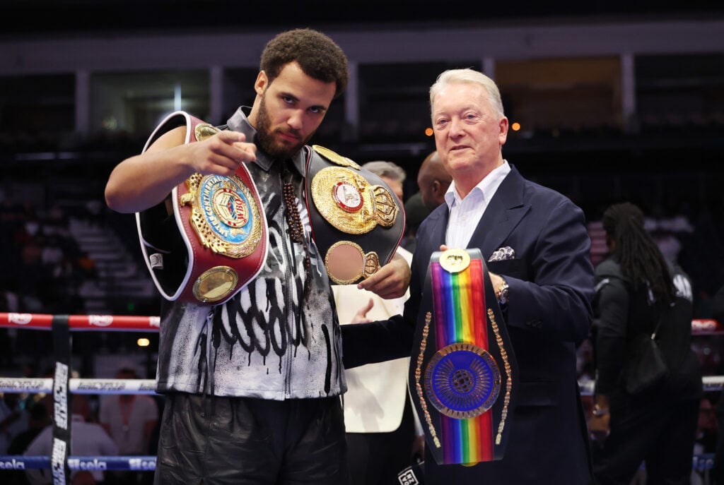 Moses Itauma pose for a photo with the belts and Frank Warren
