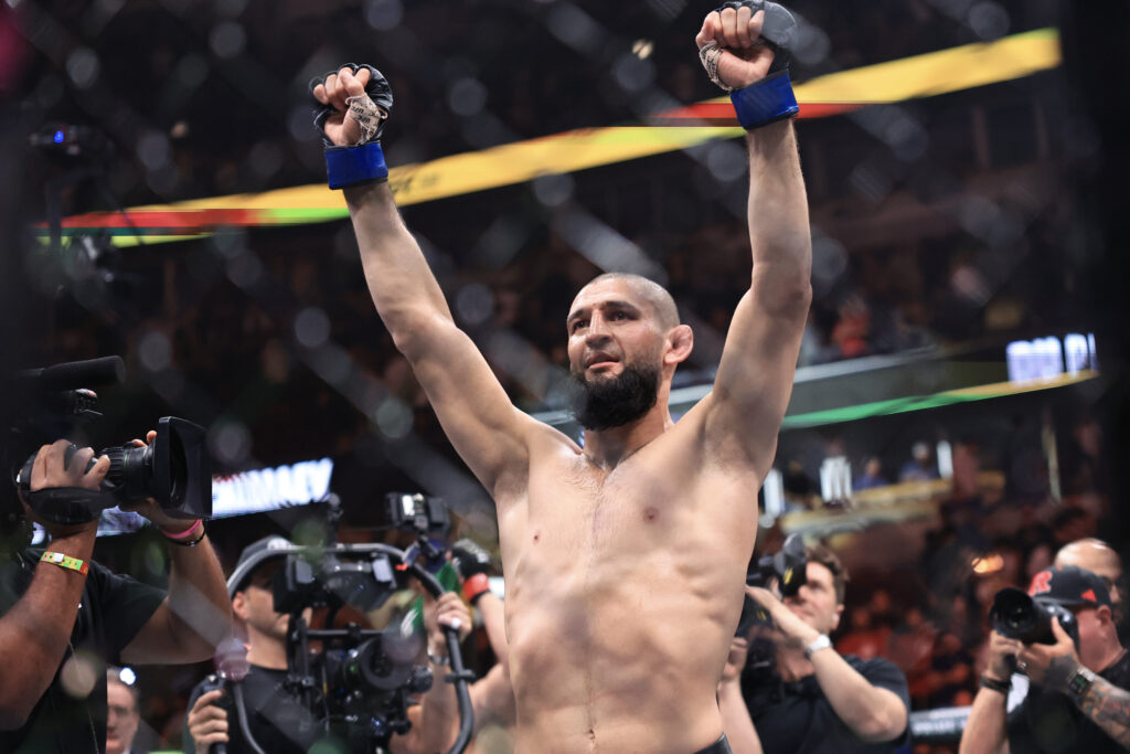 Khamzat Chimaev raises his arms in victory after Dricus Du Plessis fight
