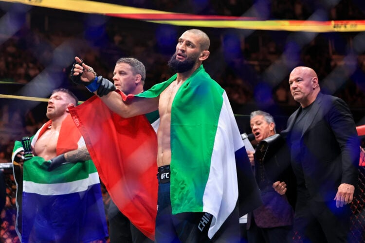 Khamzat Chimaev raises hand in victory at UFC 319