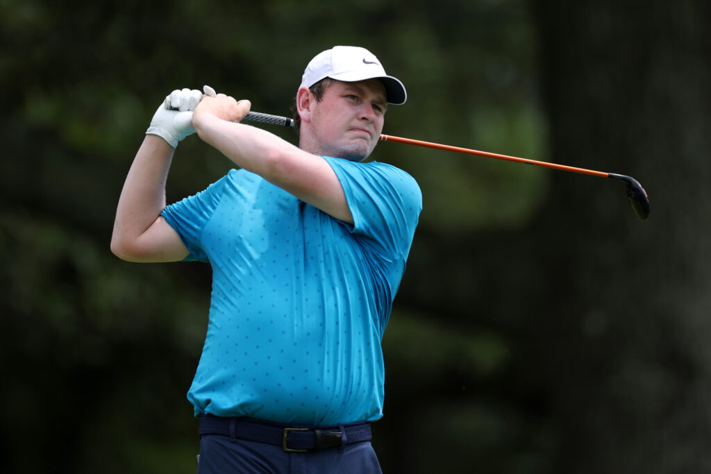 Robert MacIntyre of Scotland plays his shot from the third tee during the first round of the TOUR Championship