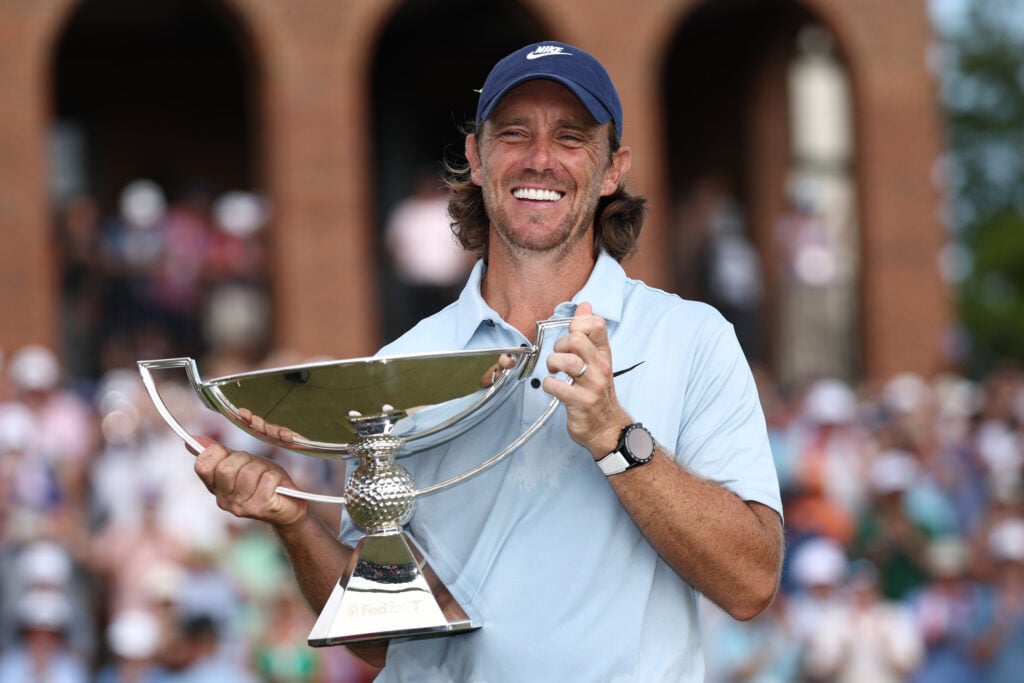 Tommy Fleetwood of England celebrates with the Fedex Cup trophy
