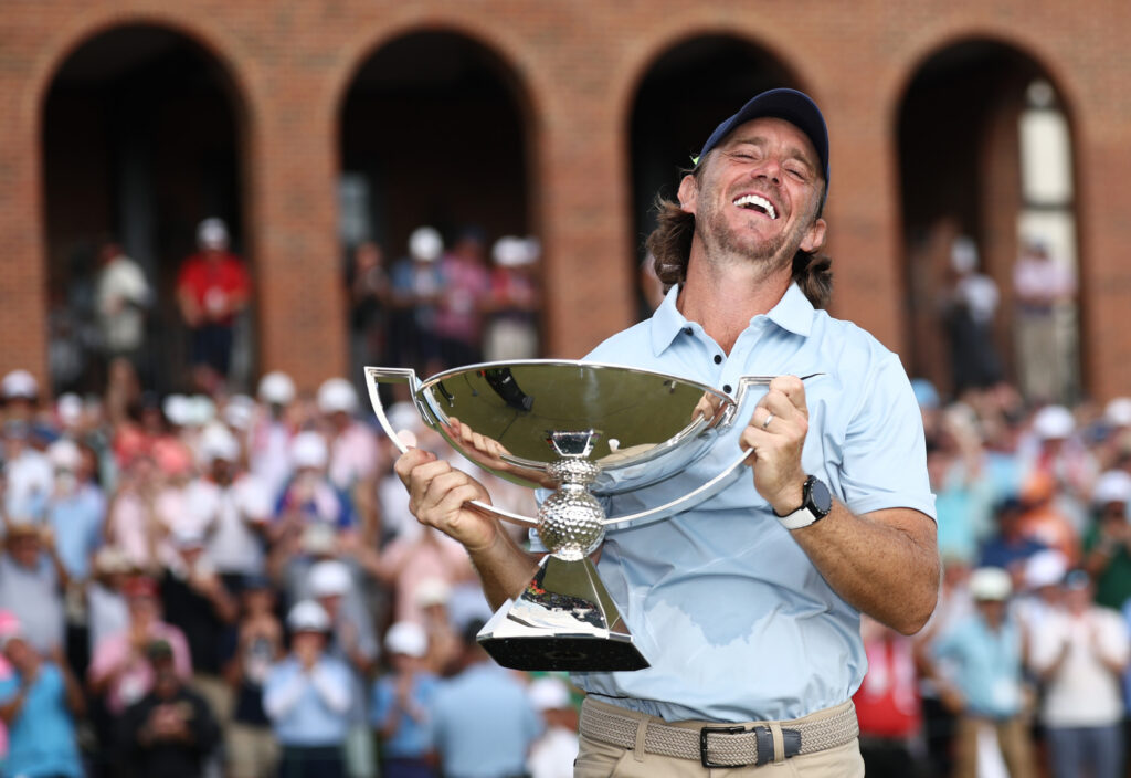 Tommy Fleetwood of England celebrates with the Fedex Cup trophy after winning the final round of the TOUR Championship