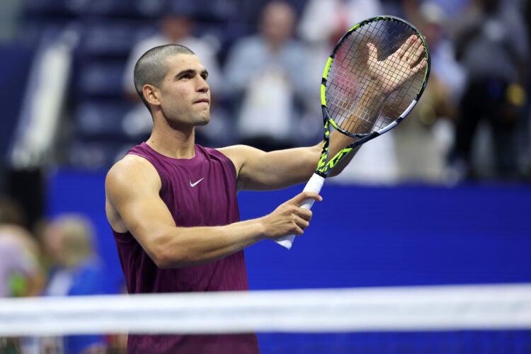 Carlos Alcaraz celebrating his win against Reilly Opelka at the 2025 US Open