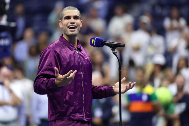 Carlos Alcaraz conducting his post-match interview after beating Reilly Opelka at the 2025 US Open