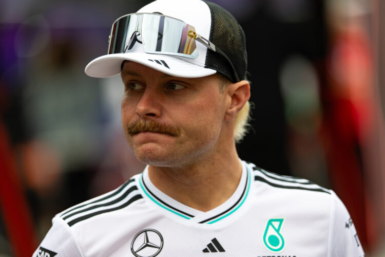 Valtteri Bottas of Finland and Mercedes looks on in the paddock during practice