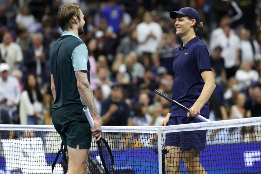 Jannik Sinner and Alexander Bublik at the net at the 2025 US Open