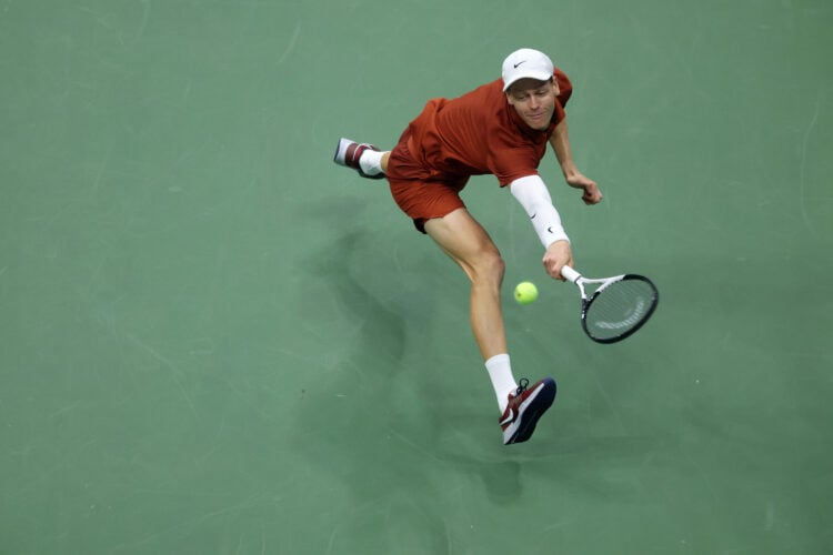 Jannik Sinner reaching for a ball during his 2025 US Open final against Carlos Alcaraz