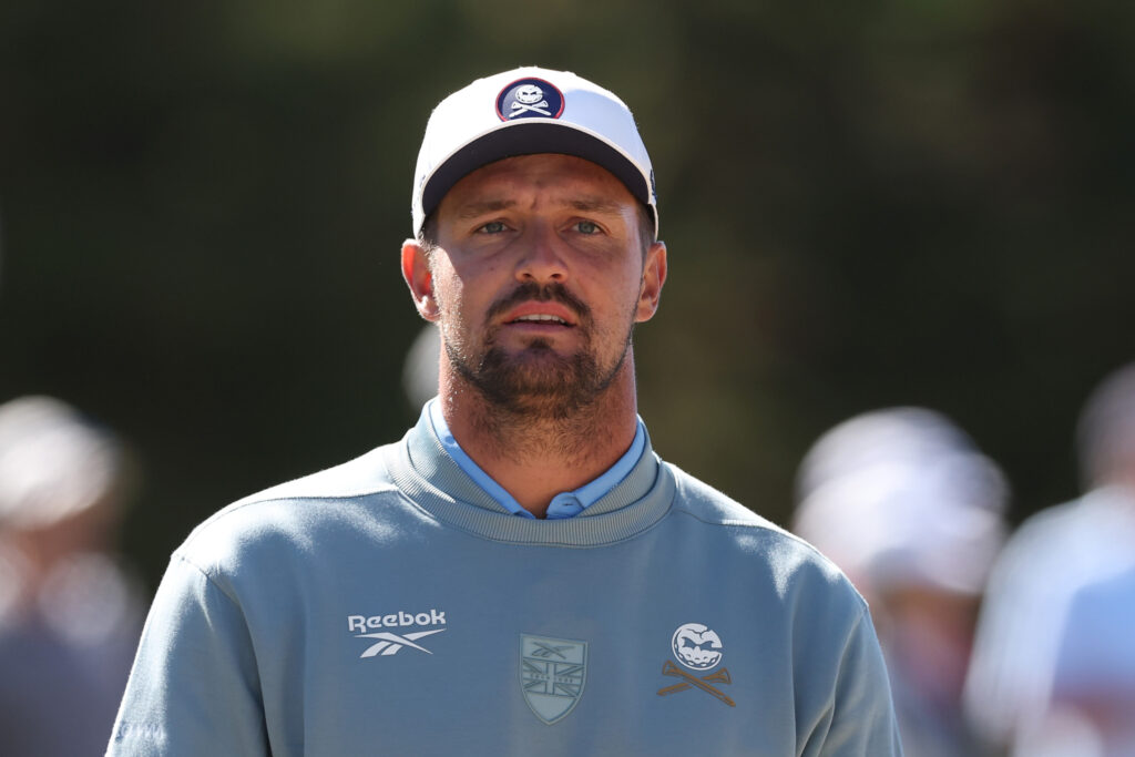 Bryson DeChambeau looks on at the Walker Cup.