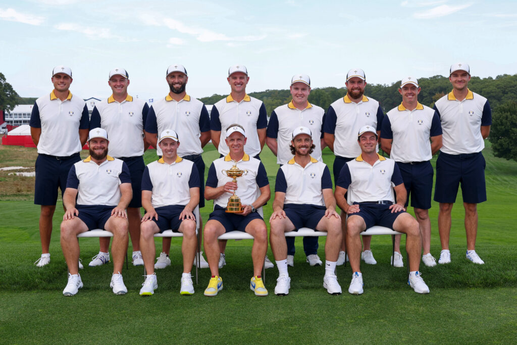 Team Europe's 2025 Ryder Cup team poses with the trophy