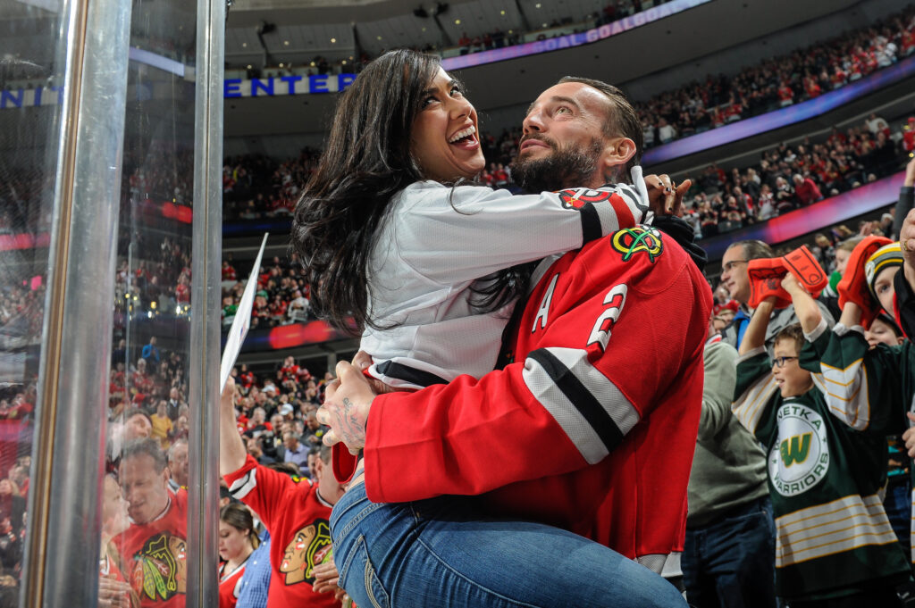 CM Punk and AJ Lee in attendance at a Chicago Blackhawks games